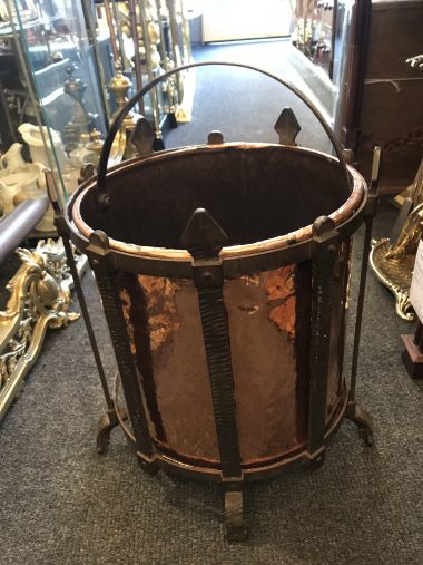 his is a superb quality Arts & Crafts copper t coal scuttle which is a very top quality piece is a very unusual shape, it is in style the same as most enclosed coal scuttles and has the added advantage of retaining it original shovel which fits neatly into the front of the bucket.