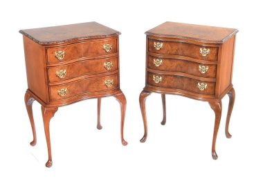 H 31" x W 20" x D 15" Description:PAIR OF WALNUT SERPENTINE FRONT BEDSIDE PEDESTALS FITTED WITH THREE DRAWERS WITH BRASS DROP HANDLES. RAISED ON QUEEN ANNE LEGS.