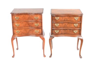 H 31" x W 20" x D 15" Description:PAIR OF WALNUT SERPENTINE FRONT BEDSIDE PEDESTALS FITTED WITH THREE DRAWERS WITH BRASS DROP HANDLES. RAISED ON QUEEN ANNE LEGS.