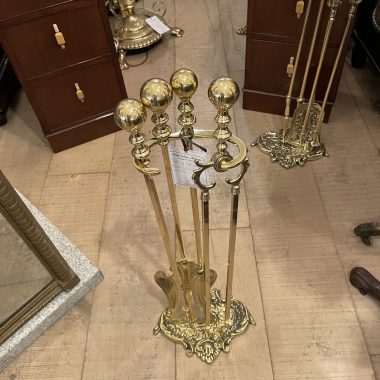 A fantastic set of brass fire irons and stand polished